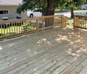 Natural wood deck with railing