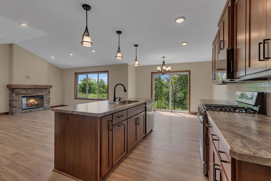 kitchen remodeling - dining and living room with fire in fireplace