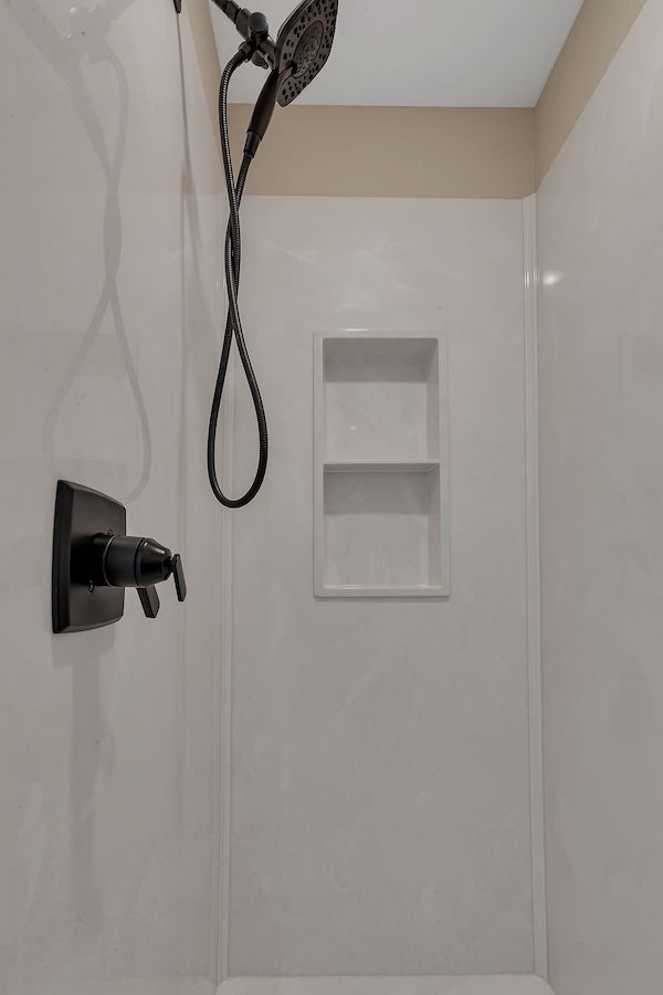 Interior of shower with dark fixtures