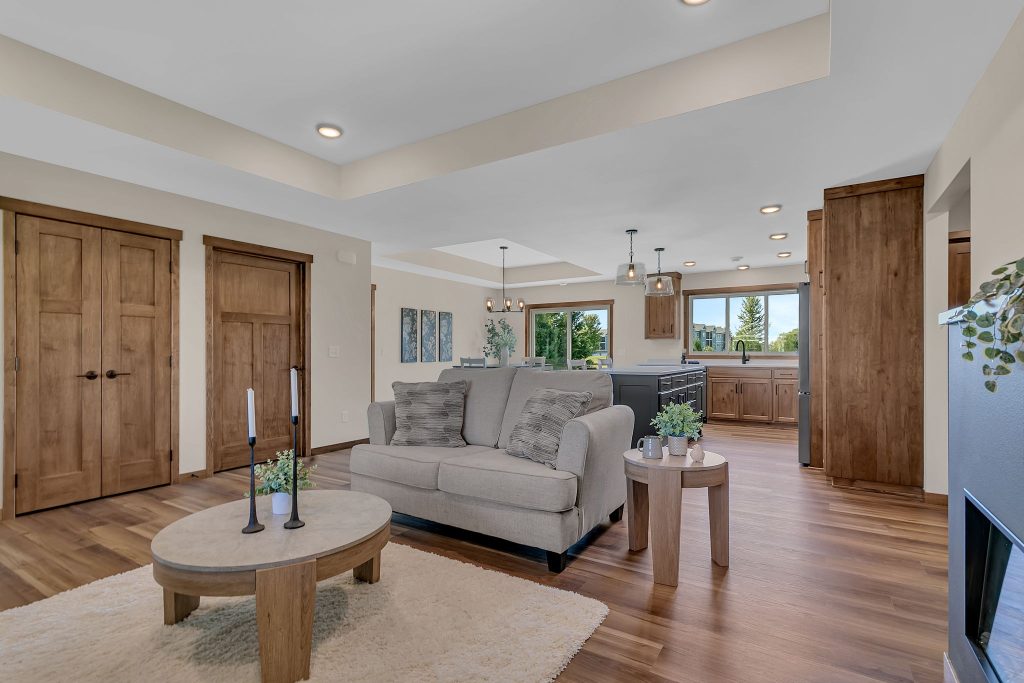 Great room seating with fireplace and kitchen