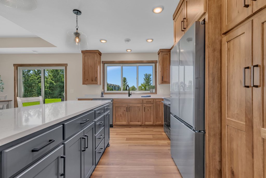 Kitchen view with stainless steel appliances and large window