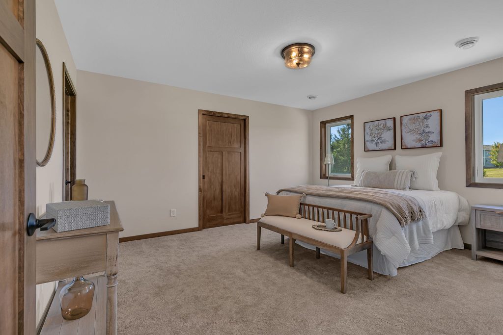 Spacious primary bedroom with natural light
